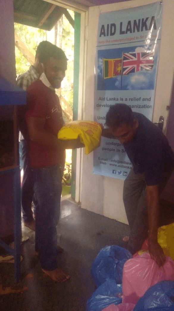 Aid Lanka delivering assistance to a family in rural Sri Lanka